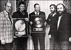 Picture of Terry Lynd (CBS), Bruce Cockburn, Alex Colville 
(artist of painiting used for Night Vision album cover), Bill Bannon (CBS), Bernie Finkelstein.